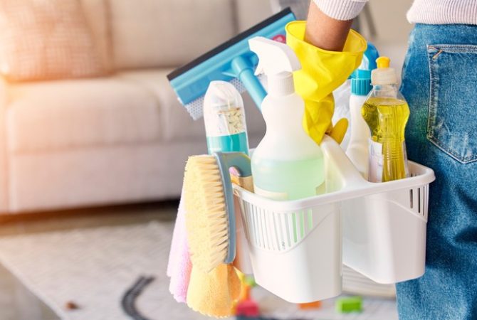 Cleaning,,Hand,And,Basket,Of,Cleaning,Supplies,For,Family,Home